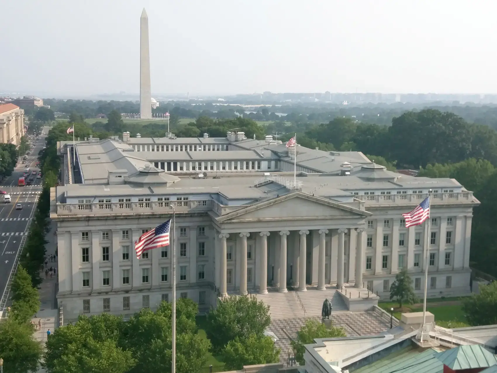 The United States Treasury Building seen from above, with the Washington Monument beyond